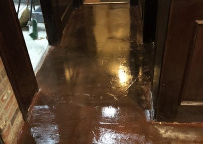 shiny concrete floor restored by servant industries bathroom