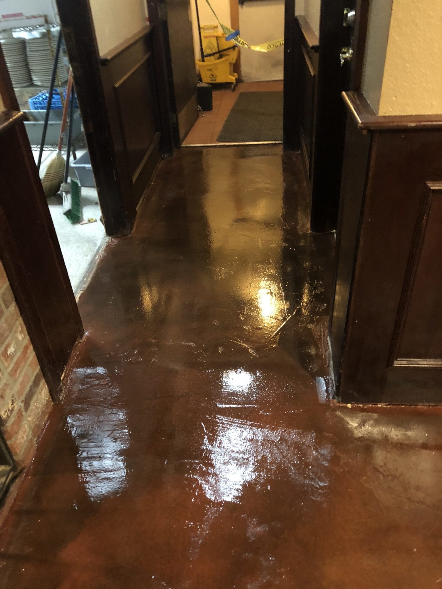 shiny concrete floor restored by servant industries bathroom