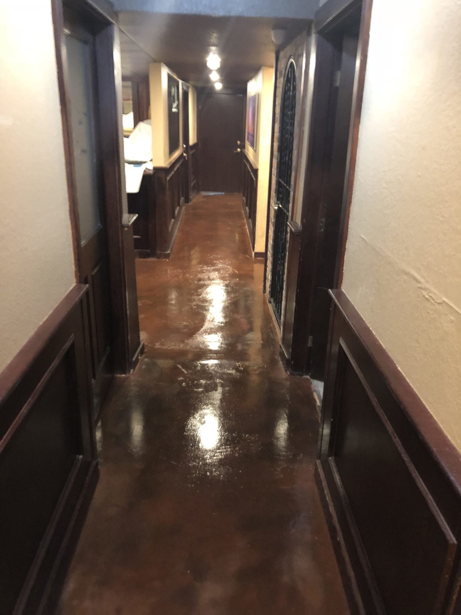 hallway shiny concrete floor restored by servant industries